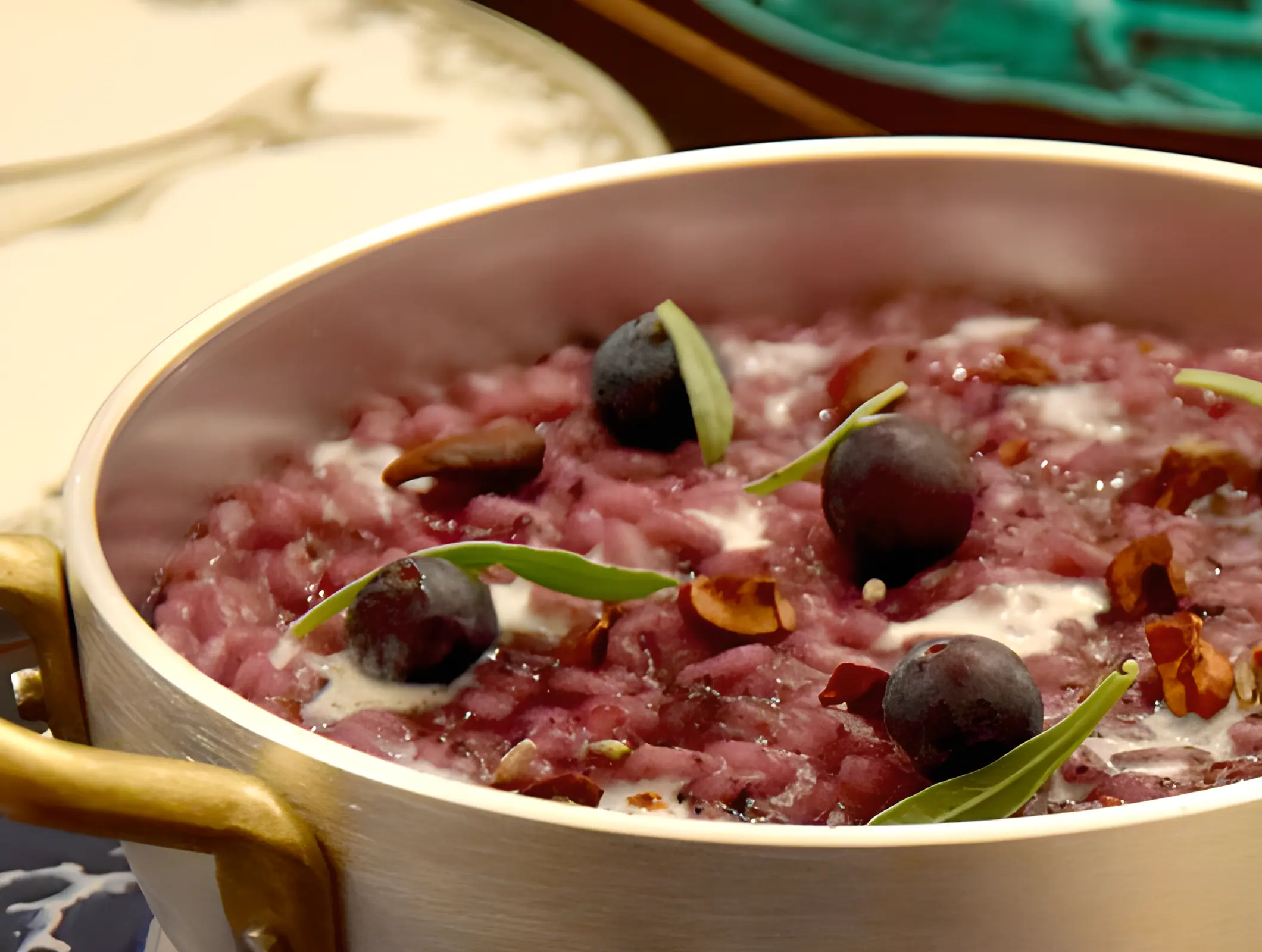 Risotto with blueberry, cacao and lavender. Chef Marcello Ferrarini