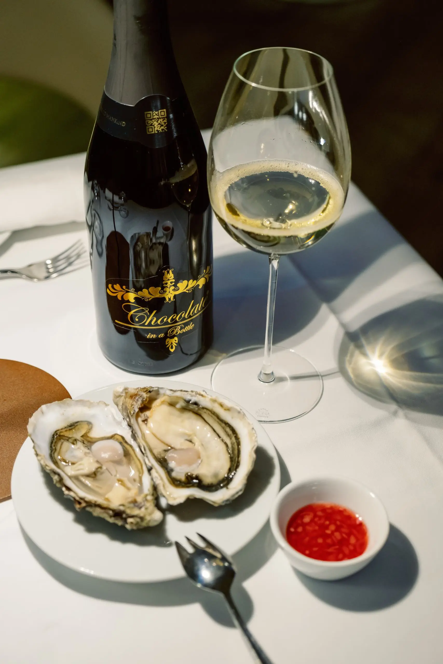 Selection of oysters with curls of butter and shallot vinaigrette